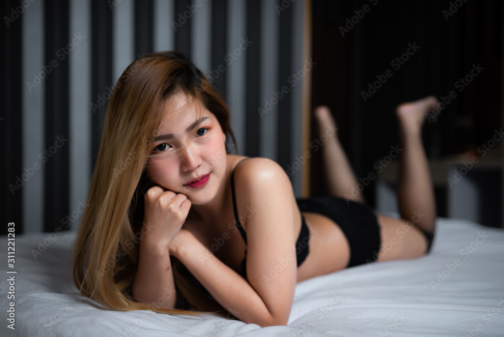 Portrait of asian sexy woman on the bed,Thailand people wear bra for take a picture Portrait of asian sexy woman on the bed,Thailand people wear bra for take a picture