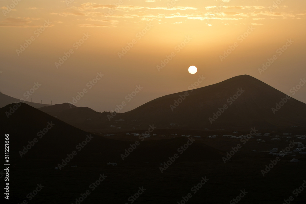 Sunrise in Lanzarote while the Calima wind is blowing.