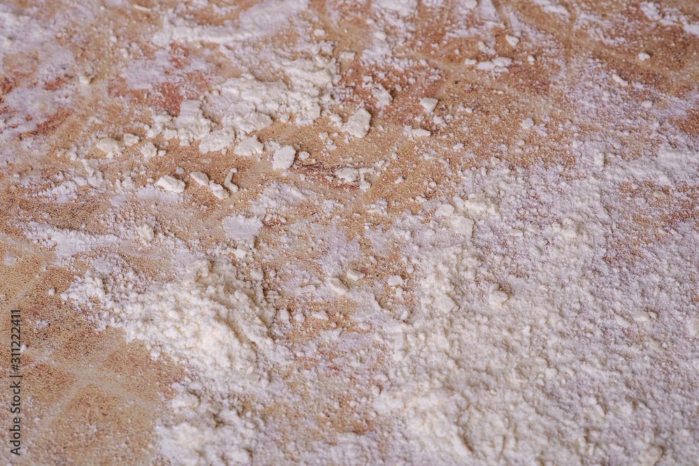 White flour on table in kitchen, preparation for cooking, texture White flour on table in kitchen, preparation for cooking, texture