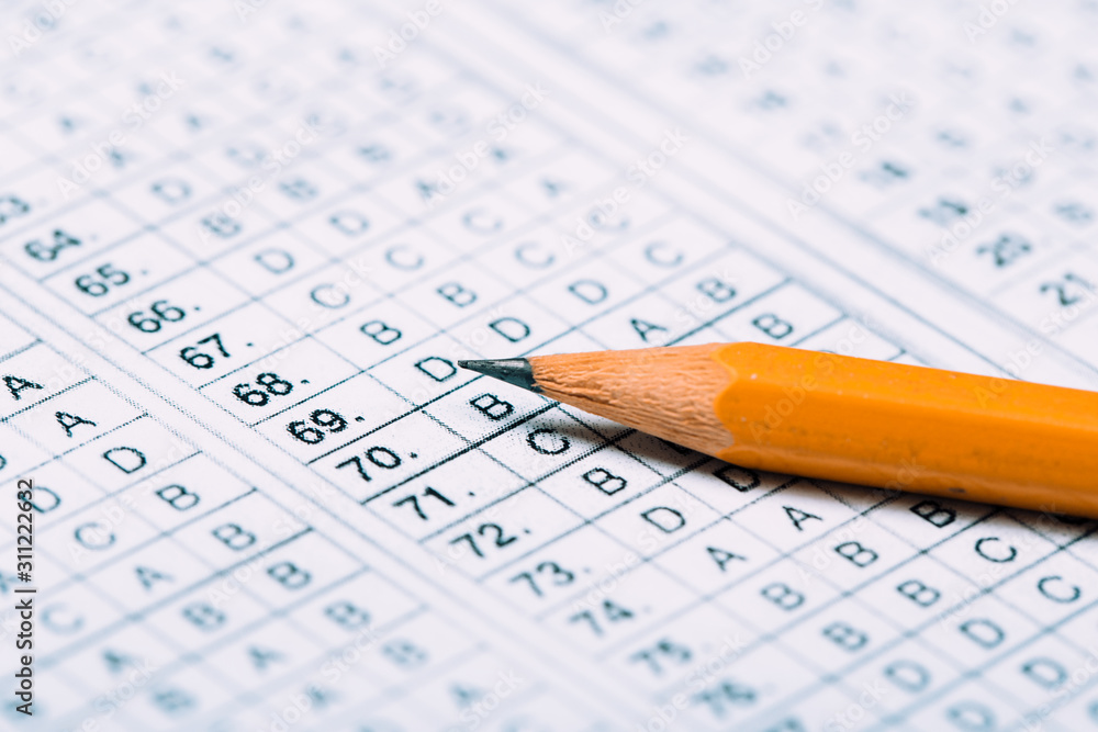 testing in exercise and exam paper. computer sheet with pencil in school test room, education concept testing in exercise and exam paper. computer sheet with pencil in school test room, education concept