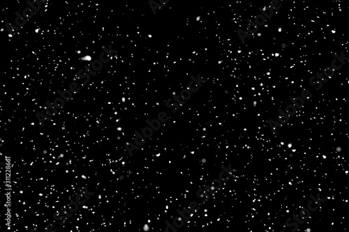 White snow falling down on black background