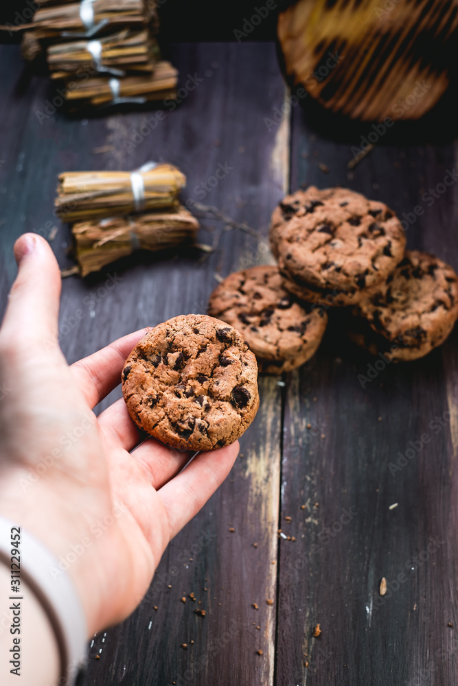 Chocolate cookies on wooden table. Chocolate chip cookies shot on black Chocolate cookies on wooden table. Chocolate chip cookies shot on black