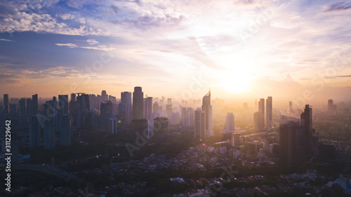 Reddish white sunrise or sunset in Jakarta city