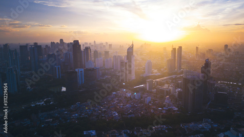 Reddish yellow sunrise in cityscape of Jakarta