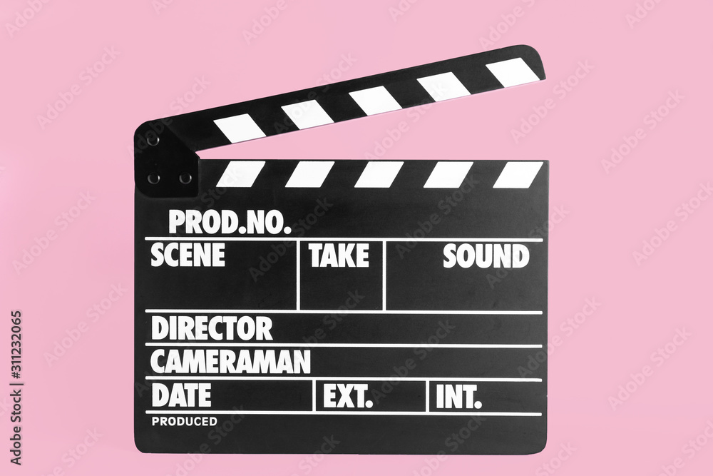 Clapper board on pink background. Cinema production