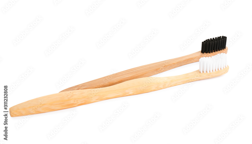 Natural bamboo toothbrushes with soft bristles isolated on white Natural bamboo toothbrushes with soft bristles isolated on white