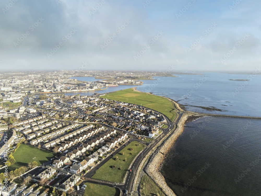 Aerial view on a South park and Salthill area of Galway city. Sunny warm day, Cloudy sky.