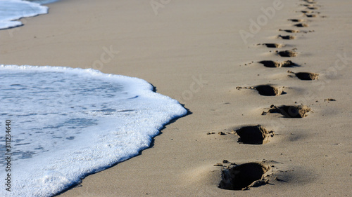 huellas en la playa  photo