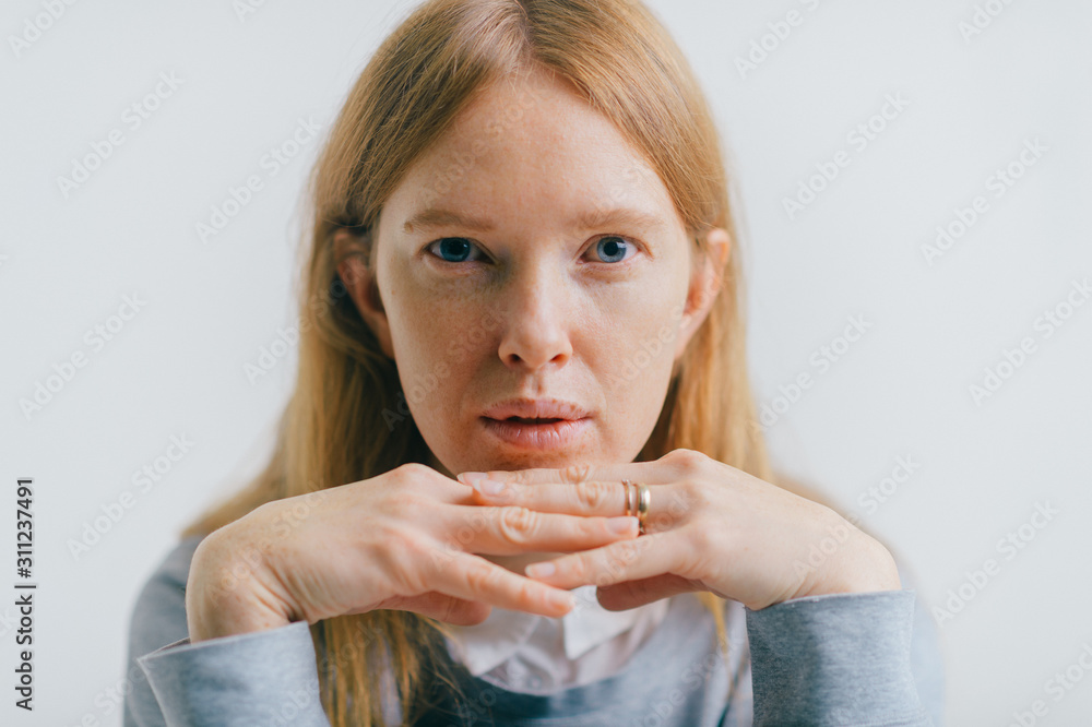 Face of a beautiful young girl with a clean freckles skin