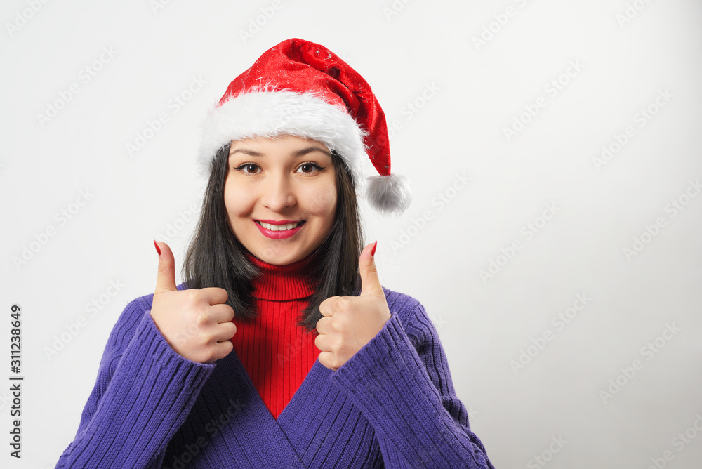 woman in red sweater and Christmas hat on white background woman in red sweater and Christmas hat on white background