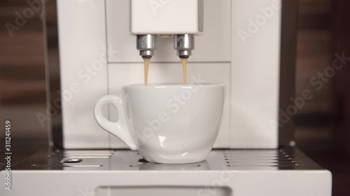 preparing fragrant espresso on your home automatic coffee machine photo