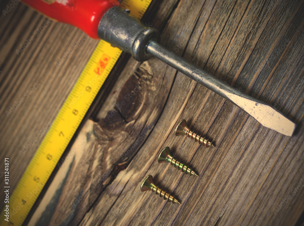 ancient screwdriver, screws and measuring lenght ancient screwdriver, screws and measuring lenght