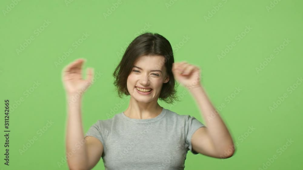 Slow-motion portrait cheerful, excited and lucky girl winning, feeling amused and thrilled good news, appear from bottom and make jazz hands gesture, congratulate, surprise friend, celebrate goal Slow-motion portrait cheerful, excited and lucky girl winning, feeling amused and thrilled good news, appear from bottom and make jazz hands gesture, congratulate, surprise friend, celebrate goal