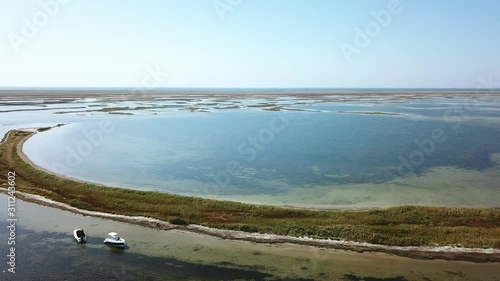 Wallpaper Mural aerial view of motorboat on the shallow, flight over motorboat near the Dzharylgach island Torontodigital.ca