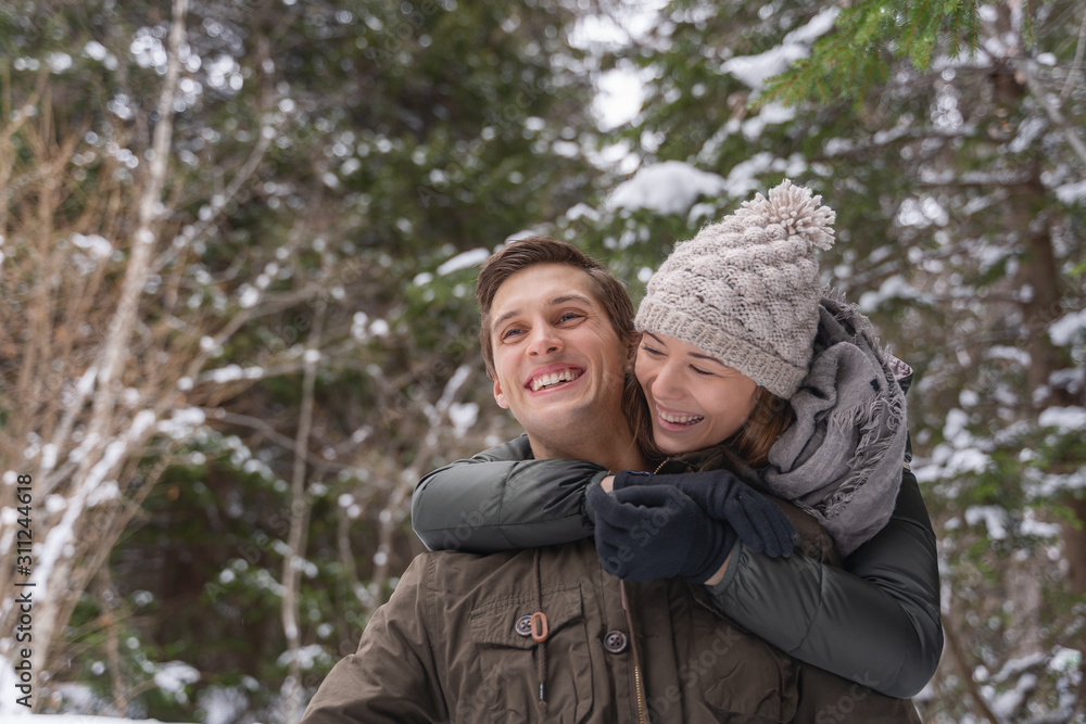 Love is always playful. Couple piggyback