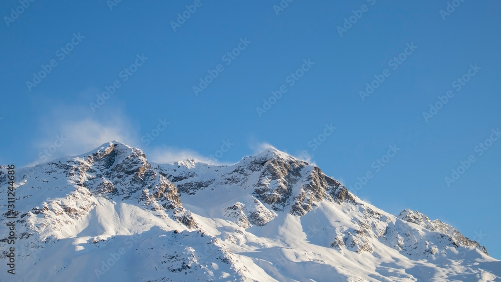 Tops of mountains with snow in St. Moritz in switzerland