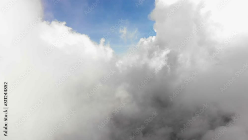Aerial shot flying through clouds, foggy, near Vulcano, sunny Aerial shot flying through clouds, foggy, near Vulcano, sunny