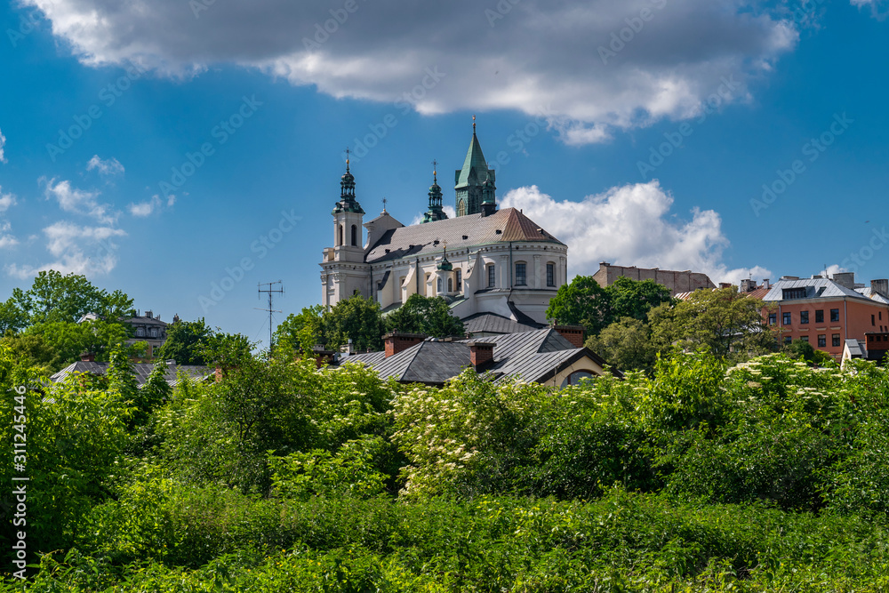 Church over treetops in Lublin, Poland
