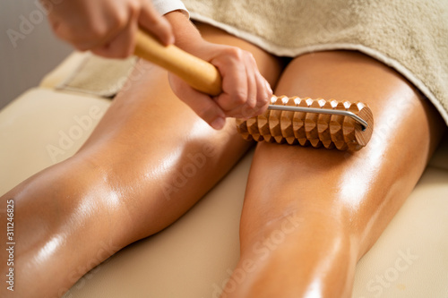 wooden roller tool for anti cellulite  massage photo
