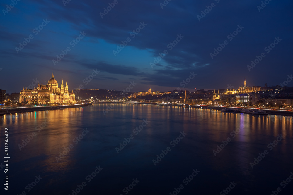 Incredible Evening View of Budapest parliament and Danube river at sunset, Hungary.
