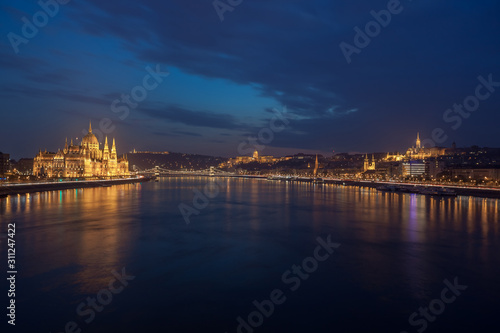 Incredible Evening View of Budapest parliament and Danube river at sunset  Hungary.