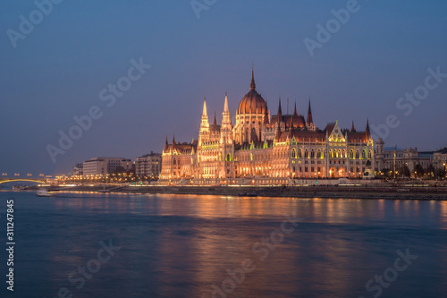 Hungarian Parliament building and Danube River in the Budapest city in the evening. A sample of neo-gothic architecture. © k_samurkas