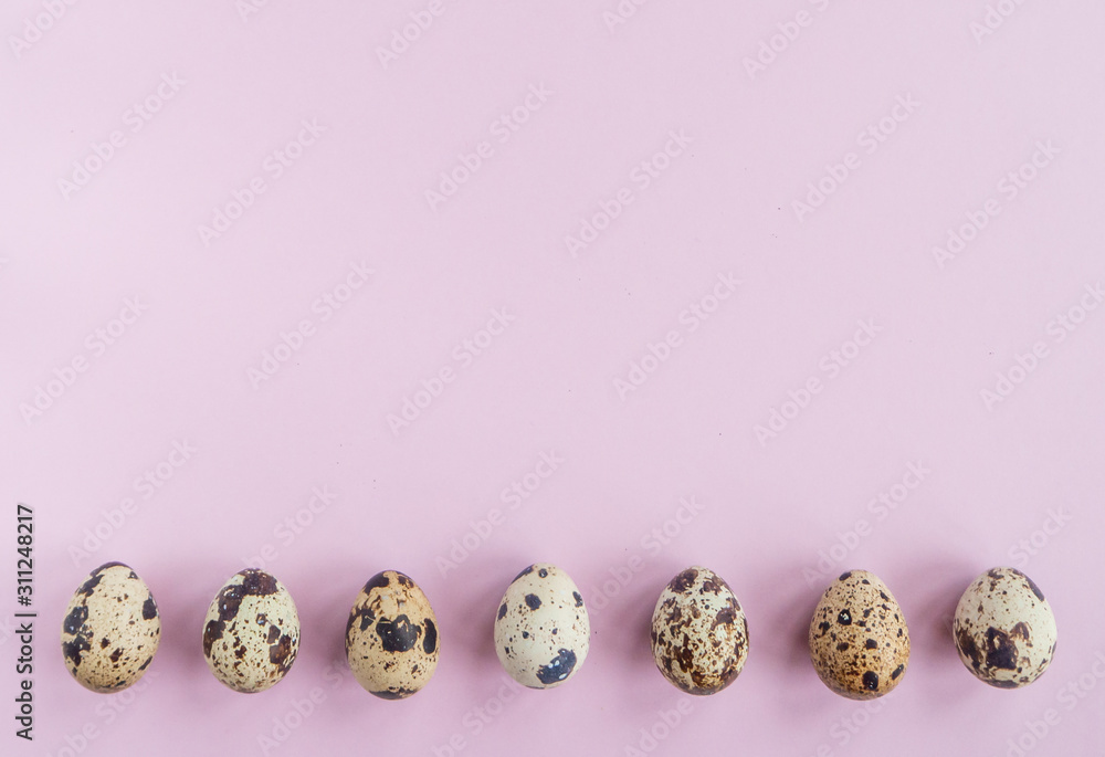 Easter flat lay with quail eggs in a row on pink background. Top view, copy space. Easter flat lay with quail eggs in a row on pink background. Top view, copy space.