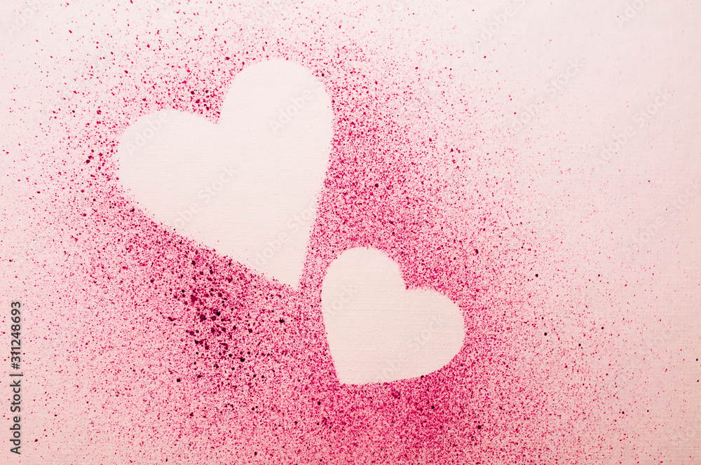 hearts on paper with watercolor pink splashes