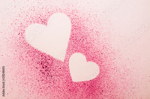 hearts on paper with watercolor pink splashes