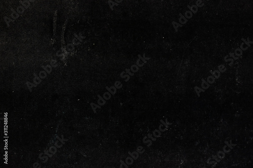 Black shabby paper surface. Black background.