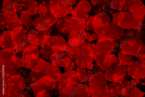 There are red hearts on the black background. Happy Valentine's Day