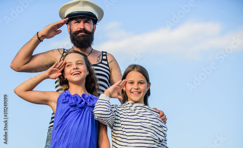 Marine tour. Sea cruise. Handsome bearded sailor with kids. Travel around world. Travel by sea. Summer travel concept. Happy family. Dad sailor and daughters outdoors. Captain welcome on board © be free
