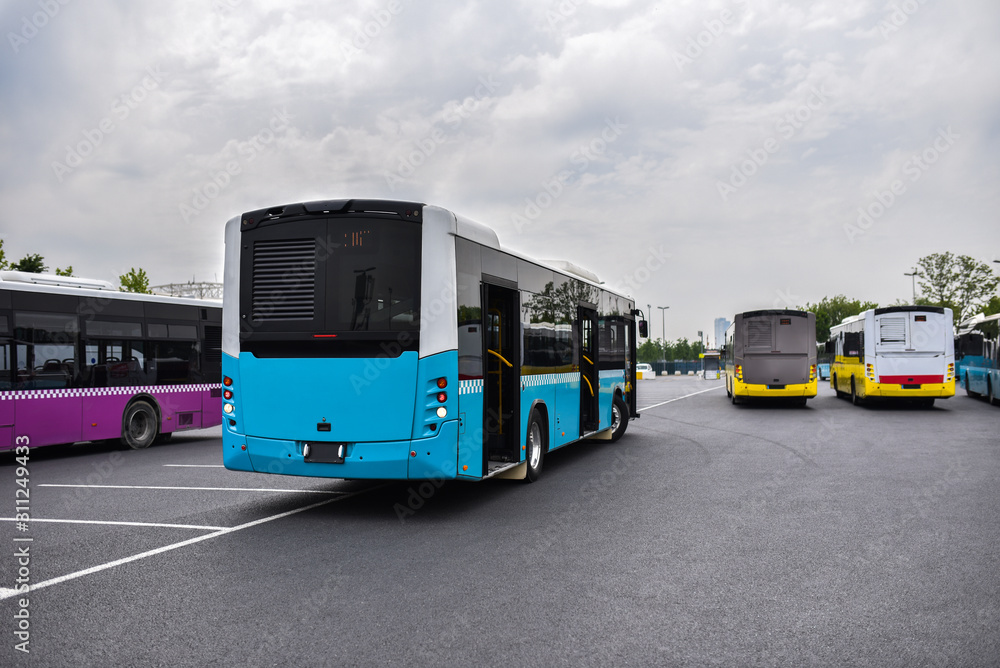 Outdoor bus depot with colorful buses