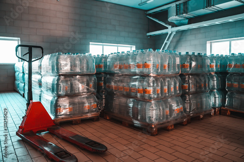 Картината върху платно Many plastic bottles with drinking pure water