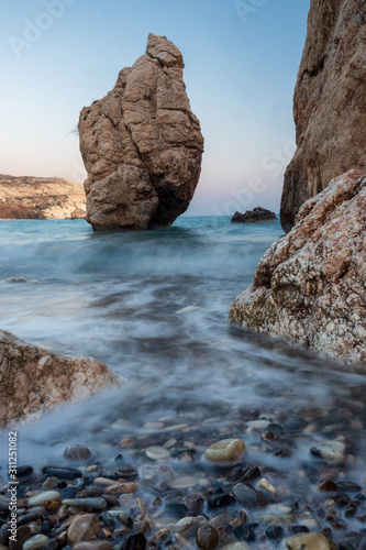 Aphrodite's stones in Cyprus near Limassol and Paphos. According to legend, these stones are the birthplace of the goddess Aphrodite. Water waves at long exposure. Pebbles in the foreground
