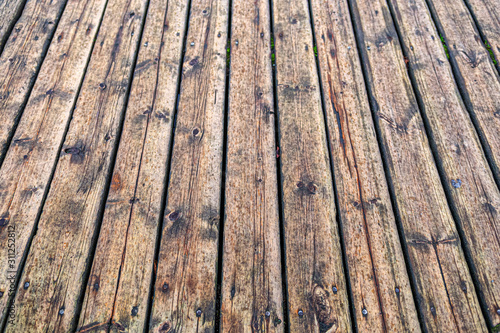 Wooden flooring of rough boards