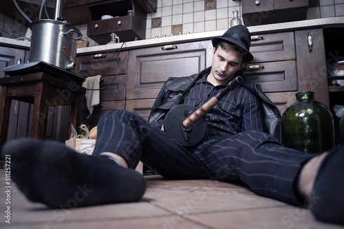 Tableau sur toile Young caucasian man with gun dead from bootleggers war during alcolol prohibition in USA in 1920-1930s