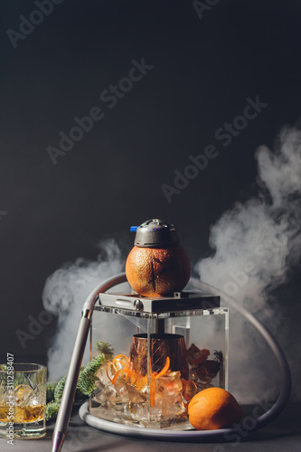 Stylish hookah with the aroma grapefruit for relax. grapefruit shisha. Hookah lounge. photo