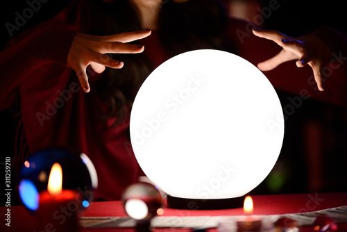 Fototapete Fortune Teller's Hands are predicting on the crystal ball.