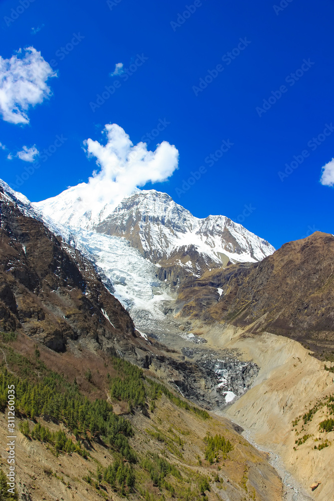 Snowy mountains of Nepal on a background of blue sky. sunny day