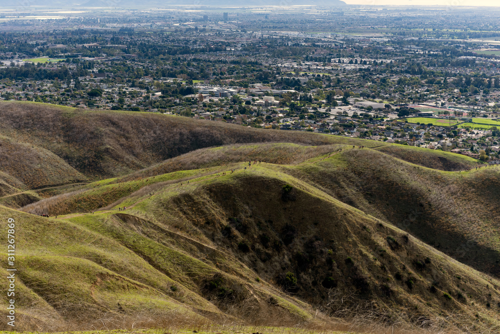 City event brings hikers treking along the ridge of Ventura hills on a hazy Autumn day trip.