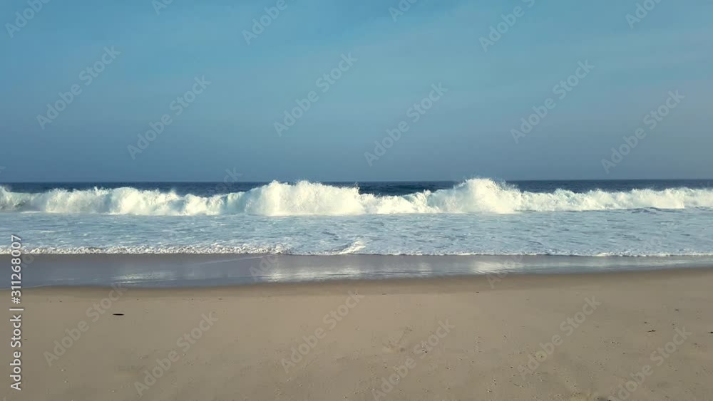Waves breaking, white foam, blue sky and sea, in Itacoatiara beach, Brazil. Waves breaking, white foam, blue sky and sea, in Itacoatiara beach, Brazil.