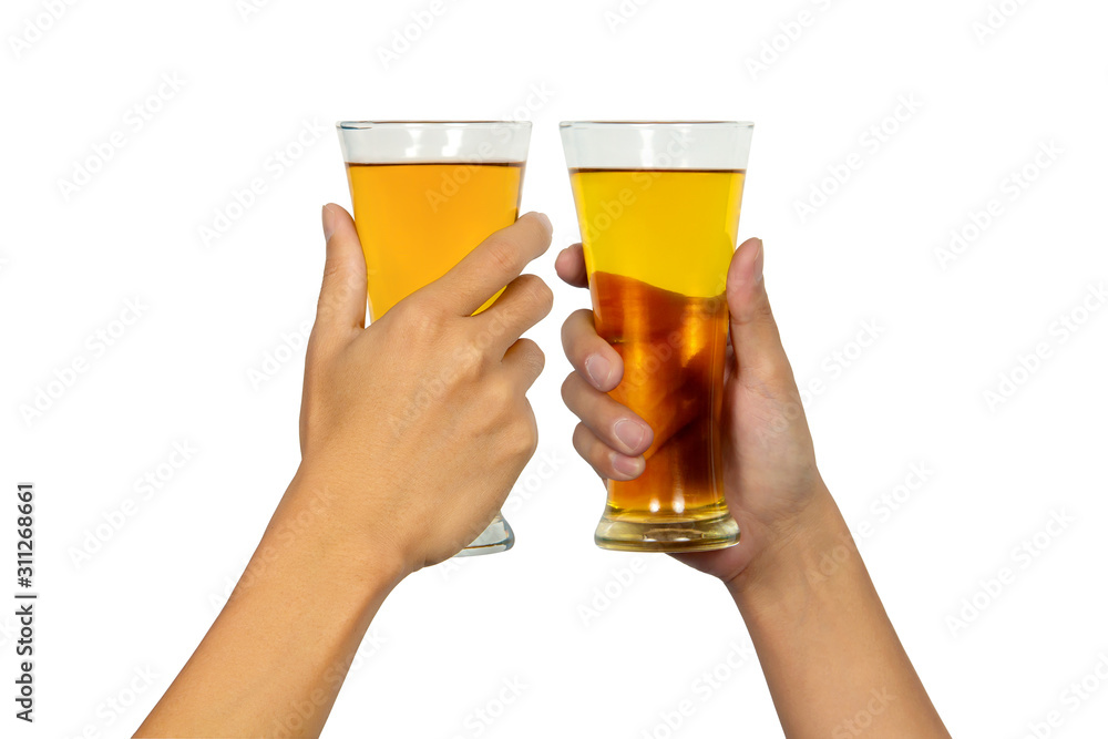 Two hands holding up and clinking beer glasses isolated on white background. Two hands holding up and clinking beer glasses isolated on white background.