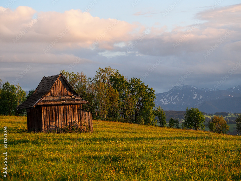 Summer sunrise mountain village outskirts view and Tatra range behind (Zab, Poland) Summer sunrise mountain village outskirts view and Tatra range behind (Zab, Poland)