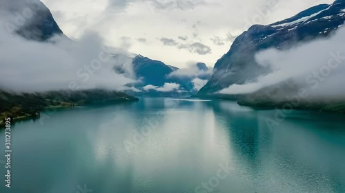 Beautiful Nature Norway natural landscape lovatnet lake flying over the clouds. photo