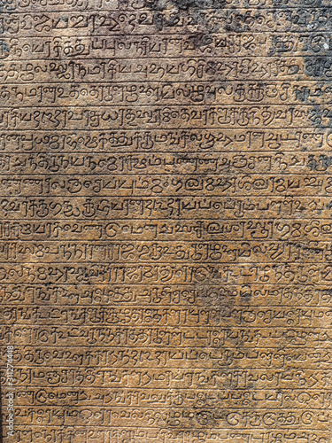 Ancient stone inscriptions in Singalese language texture. Pollonaruwa, Sri Lanka photo