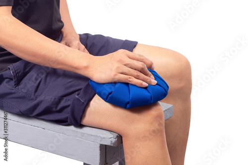 Man hand holding ice pack compress to the knee, relieving pain. isolated on white background.