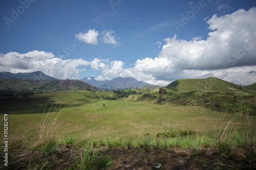 Bondowoso, East Java / Indonesia Savana Wurung Crater (Kawah Wurung) during the dry season, located in Curah Macan village, Bondowoso. photo