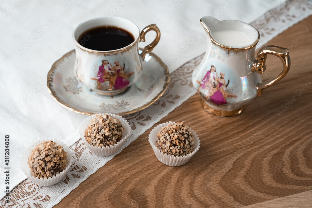 An excellent moment of relaxation over a Cup of coffee with cream and chocolates in waffle crumbs. An excellent moment of relaxation over a Cup of coffee with cream and chocolates in waffle crumbs.