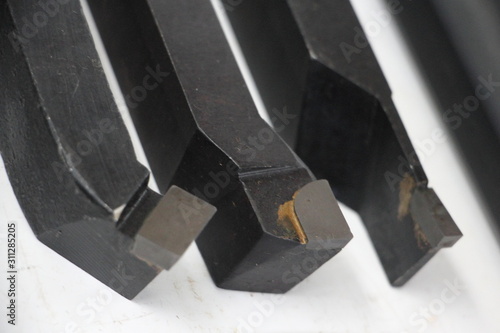Obraz na płótnie Lathe turning tools with carbide tips close-up, Metalworking tools w salonie